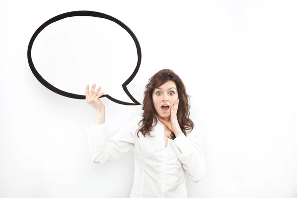 Pretty young brunette caucasian woman surprised with comic baloon on white background — Stock Photo, Image