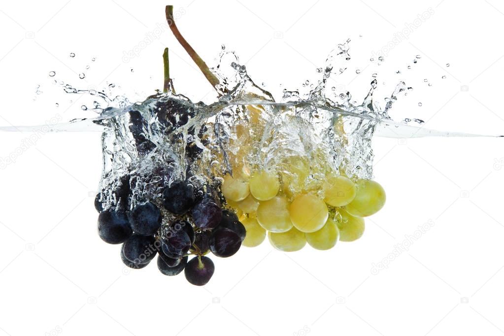 grapes fruits making splash in water