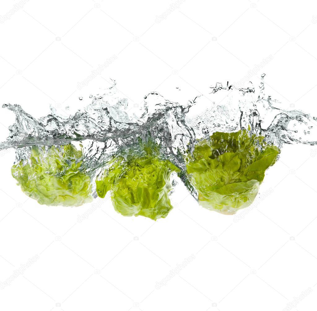 green salad vegetables making splash in water