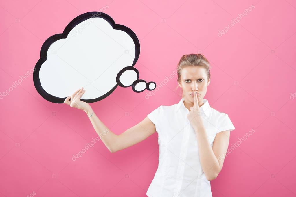 pretty young blond caucasian woman thinking ideas with comic baloon  on pink background