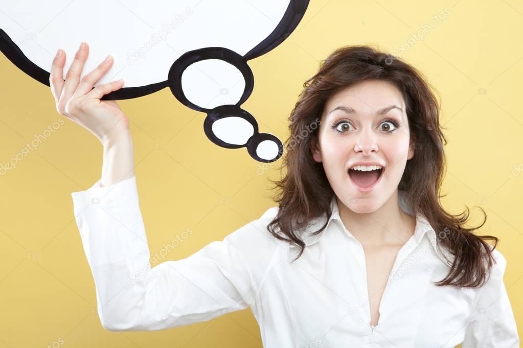 pretty young brunette caucasian woman thinking ideas with comic baloon  on yellow background