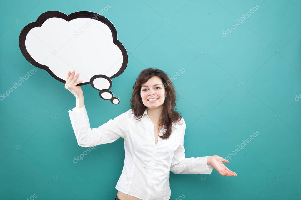 pretty young brunette caucasian woman thinking ideas with comic baloon and smile  on blue background