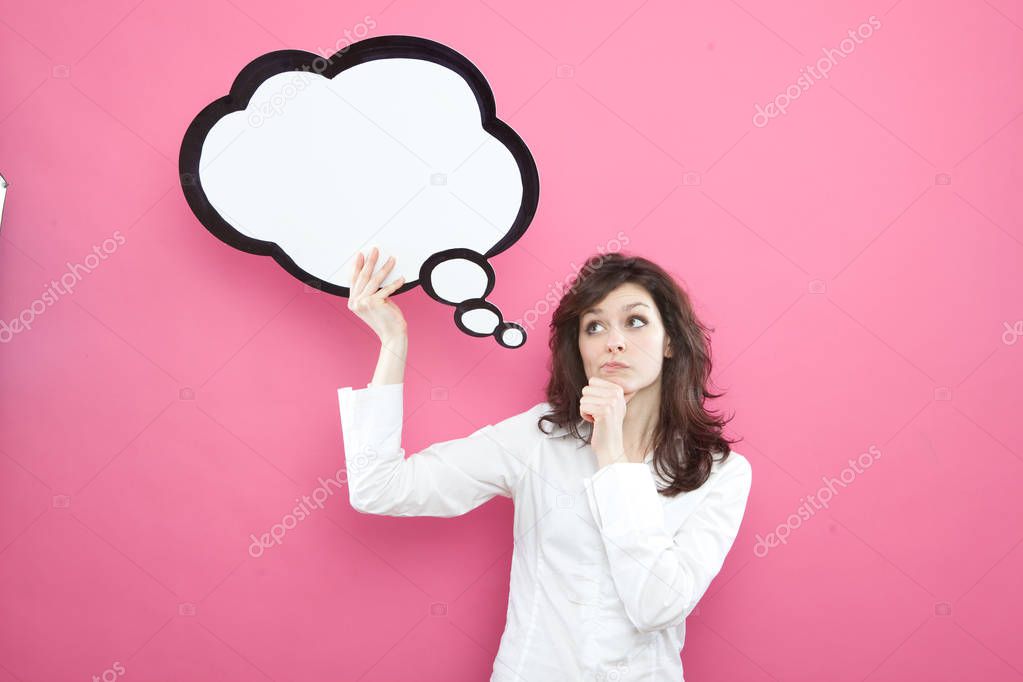pretty young brunette caucasian woman thinking ideas with comic baloon  on pink background