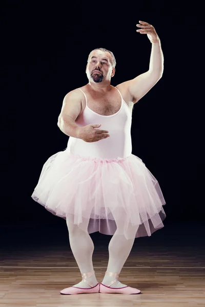 Funny fat classical dancer on black background — Stock Photo, Image