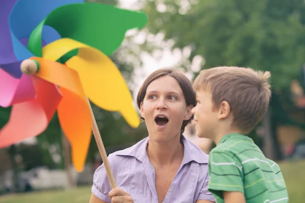 Happy blond caucasian kid outdoor family portrait at park with his mum — Stock Photo, Image