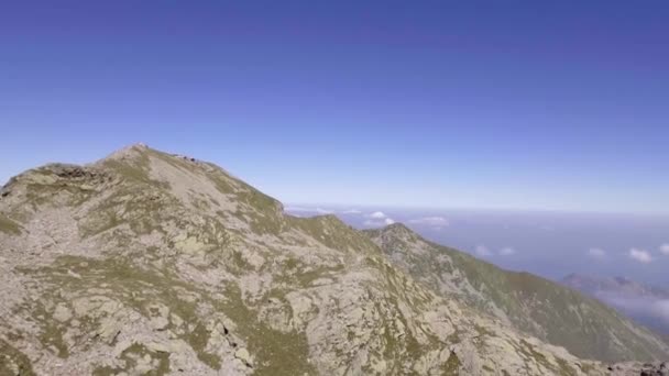 Italy Alps mountains aerial on rocky side in summer sunny day. 4k drone side flight wide establishing shot — Stock Video