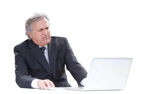 Angry senior businessman isolated on white using laptop — Stock Photo, Image