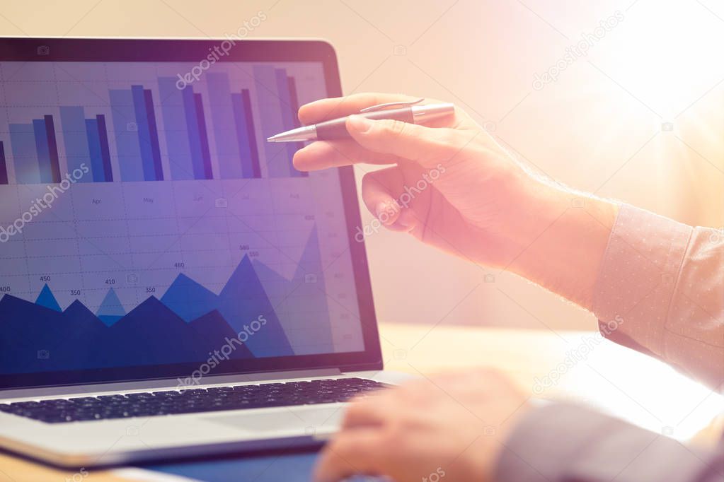 Businessman working on global financial trading growth analysis strategy using laptop.Modern business innovation investment concept.Office project with virtual forex graph and chart data interface