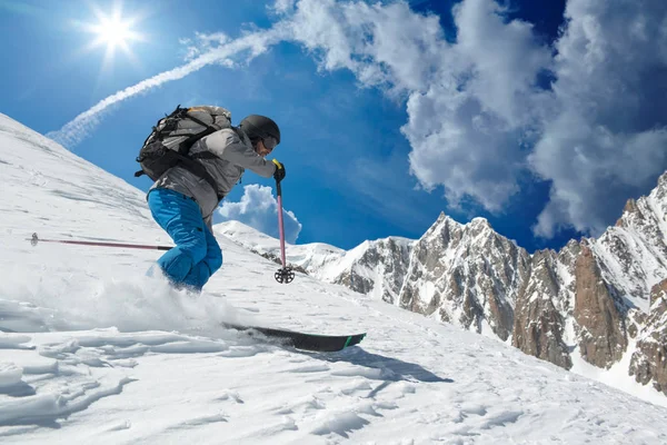 Skier man skiing on glacier or snowy slope with fresh powder. Europe Alps Mont Blanc massif mount. Winter sunny day, snow. Wide long shot, alpine ski extreme sport activity — Stock Photo, Image