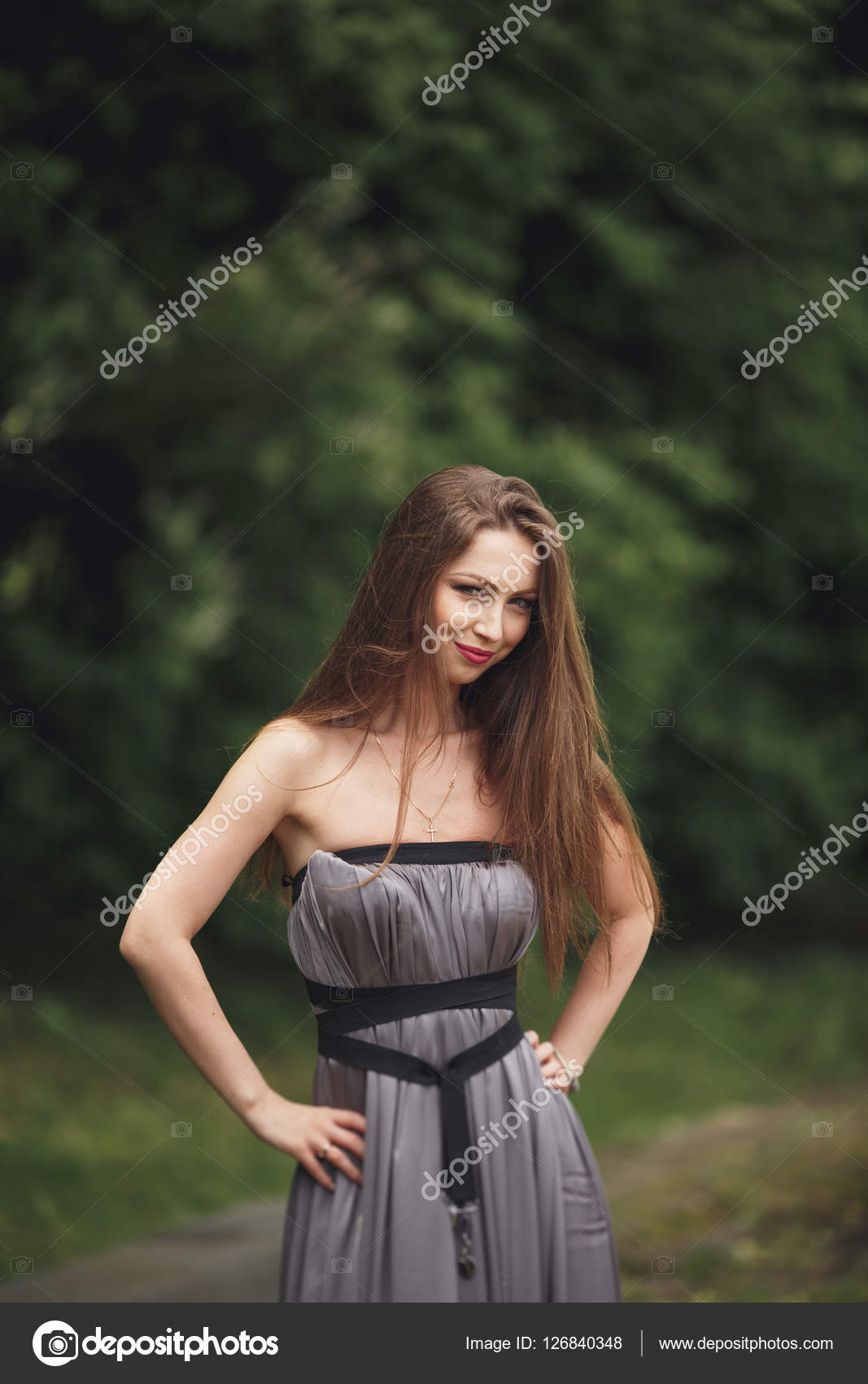 Beauty Romantic Girl Outdoors. Teenage Model with Casual Dress in park.  Blowing Long Hair. Stock Photo by © 126840348