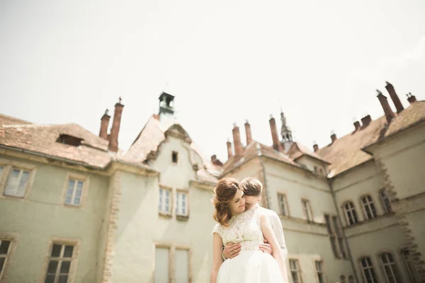 Amazing happy gentle stylish beautiful romantic caucasian couple on the background ancient baroque castle — Stock Photo, Image