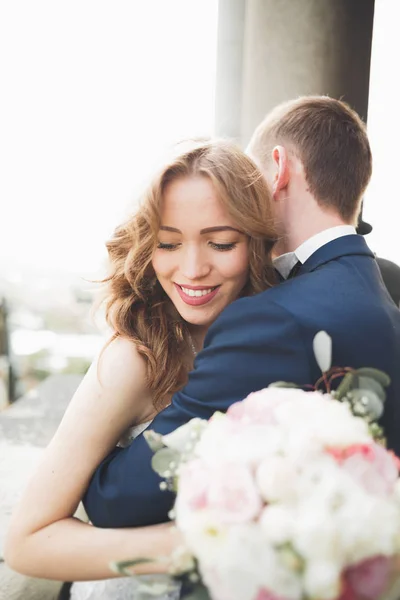 Gorgeous wedding couple walking in the old city of Lviv — Stock Photo, Image