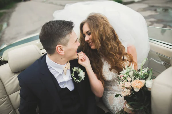 Happy bride and groom posing after wedding ceremony — Stock Photo, Image