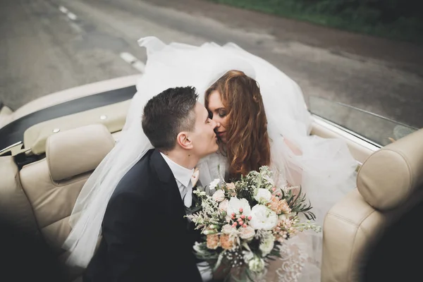 Happy bride and groom posing after wedding ceremony — Stock Photo, Image