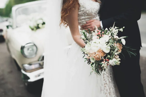 Luxury wedding bouquet in brides and groom hands — Stock Photo, Image