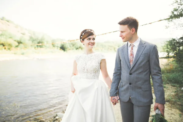 Wedding couple bride and groom holding hands — Stock Photo, Image