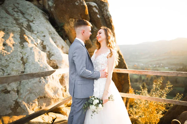 Gorgeous happy couple standing close to each other and looking in eyes — Stock Photo, Image