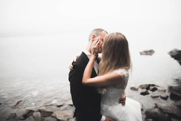 Kissing wedding couple in spring nature close-up portrait — Stock Photo, Image