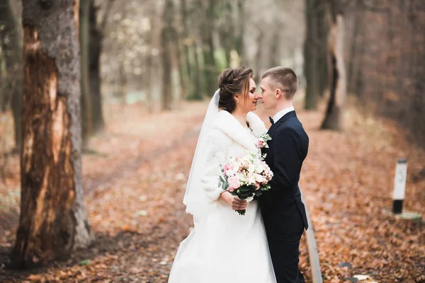 Gorgeous happy couple standing close to each other and looking in eyes — Stock Photo, Image