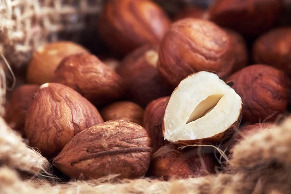 Peeled hazelnuts in burlap bag — Stock Photo, Image