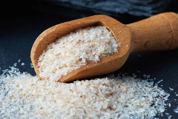 Psyllium Ispaghula Casca Colher Madeira Sobre Fundo Rústico Preto — Fotografia de Stock