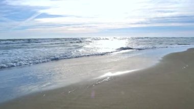 The Beach stock video is a fine piece of video that shows calm beach waves sweeping up the shore on a sunny day. You can use this 1920x1080 (HD) bit of video in any project that has to do with the beach and traveling. 