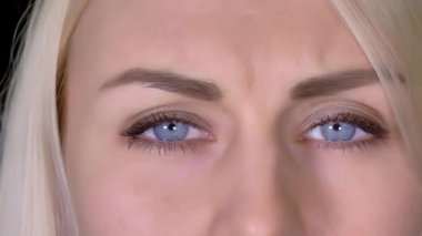 lose-up Of Beautiful Blue Eye is an excellent stock video that exhibits a beautiful blue eyes blinking. It is easy to tell that it is a woman's eye. 