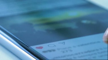 Social Media On Phone is a stock video that contains awesome footage of a woman checking her social media account on her smartphone. She taps the heart icon to like the posts of her friends. 