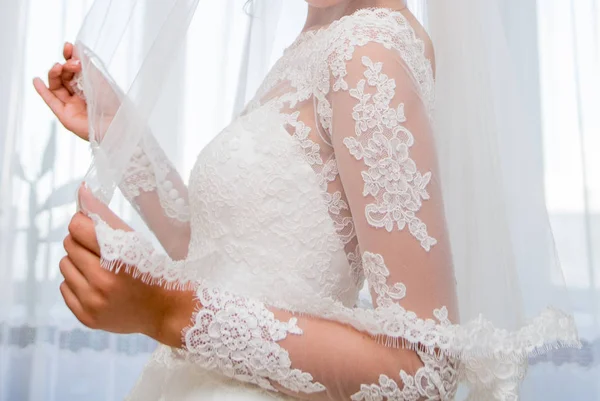 Bride holding a veil — Stock Photo, Image