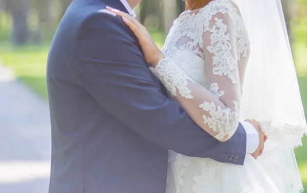 Bride hugging groom — Stock Photo, Image