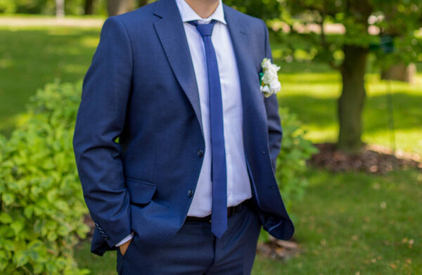 The groom in a blue suit