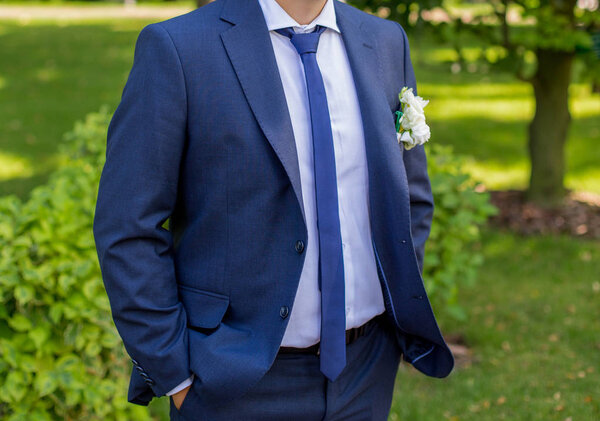 The groom in a blue suit