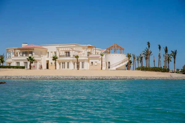 resort buildings between blue sky and sea