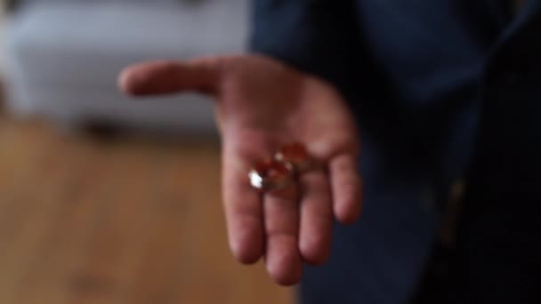 Man Holds Wedding Rings His Hands — Stock Video