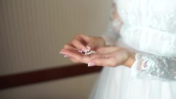 Bride Holds Earrings Her Hand — Stock Video