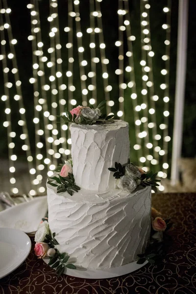 bride and groom cut a wedding cake