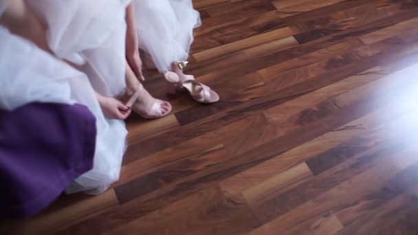 Bride Puts Wedding Shoes — Stock Video