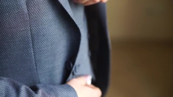 Man Straightens Suit Jacket — Stock Video