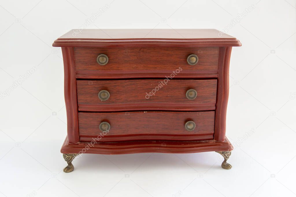 wooden chest of drawers on white background