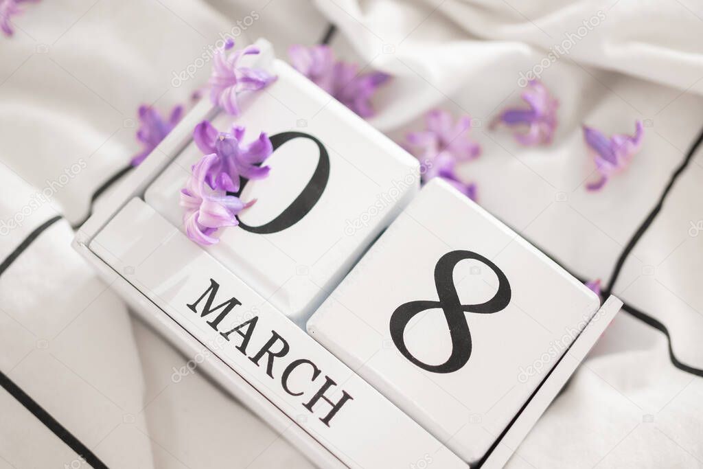 White infinite calendar on white background with 8 march date. International womans day