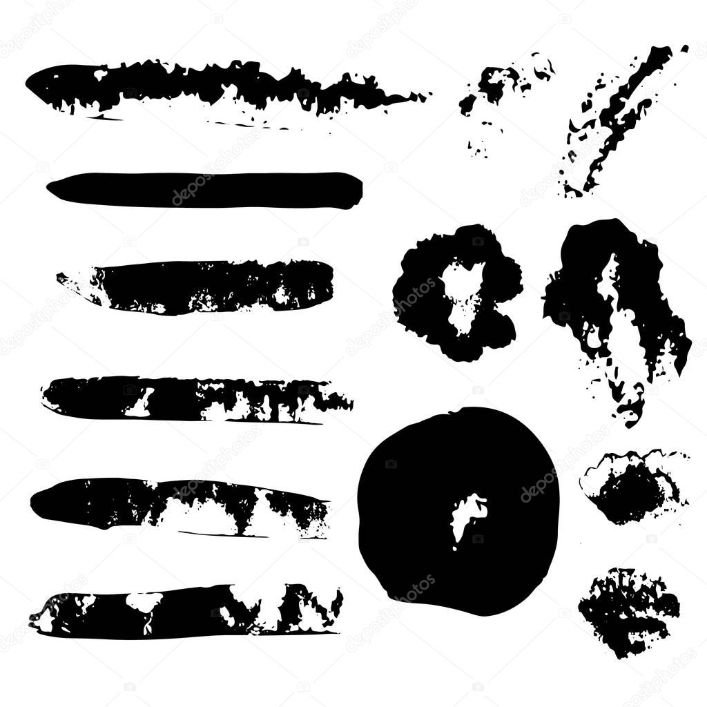 Set of hand drawn grunge strokes. Black ink brush strokes, stains and blots isolated on white. Abstract shapes