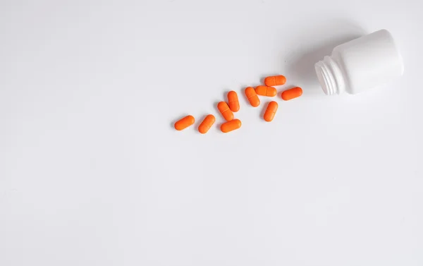 Tabletter i plastburk ovanifrån — Stockfoto