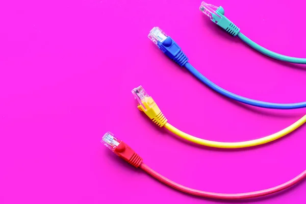 Concept network internet cable on pink background close up — Stock Photo, Image