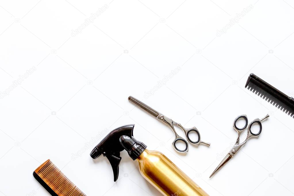 combs and hairdresser tools on white background top view