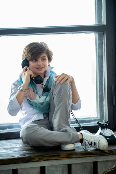 Cute Boy Sitting Windowsill Talking Telephone — Stock Photo, Image