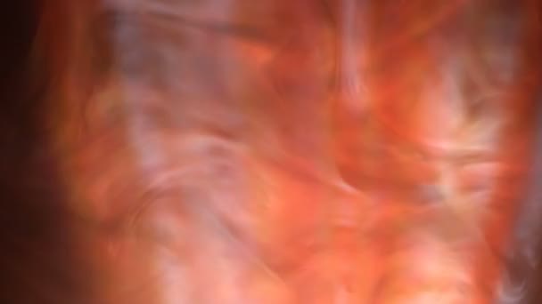 煙のループオレンジのクローズアップ映像 — ストック動画