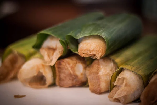 A stack of traditional food cake wrap in banana leaf photo taken in jogja yogyakarta indonesia — ストック写真