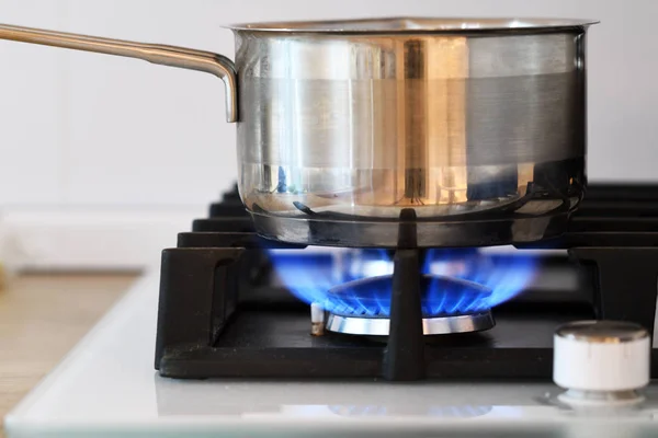 Boiling pot on the gas stove fire