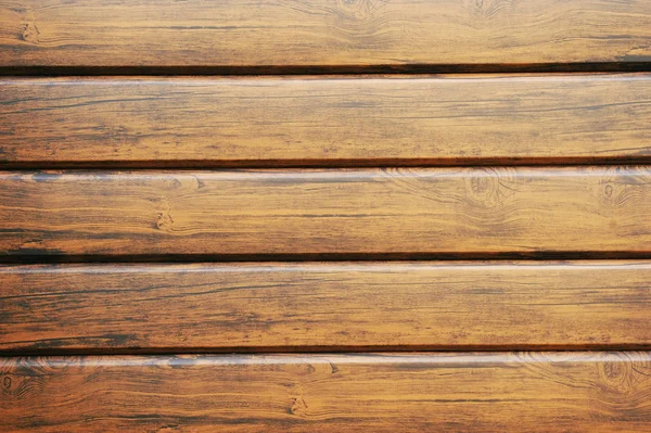 Metal lining on the facade of the building imitating the texture of wood.Element of the facade. Part of the facade decoration close-up. Facing material of buildings. Metal sheet roof.