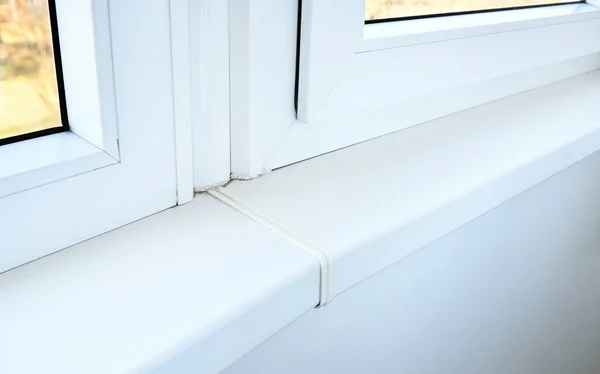 Modern White Plastic Window Sill Apartment Low Quality Joint Plastic — Stock Photo, Image